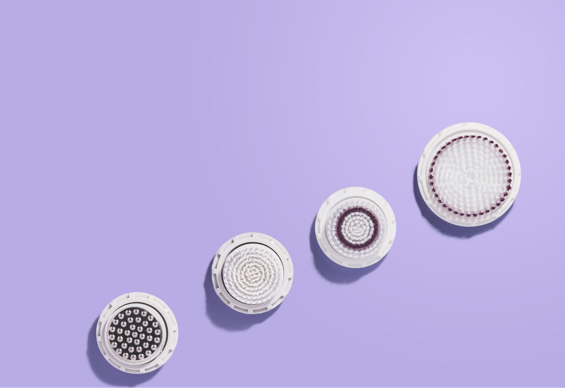 Four circular plates on a purple background.