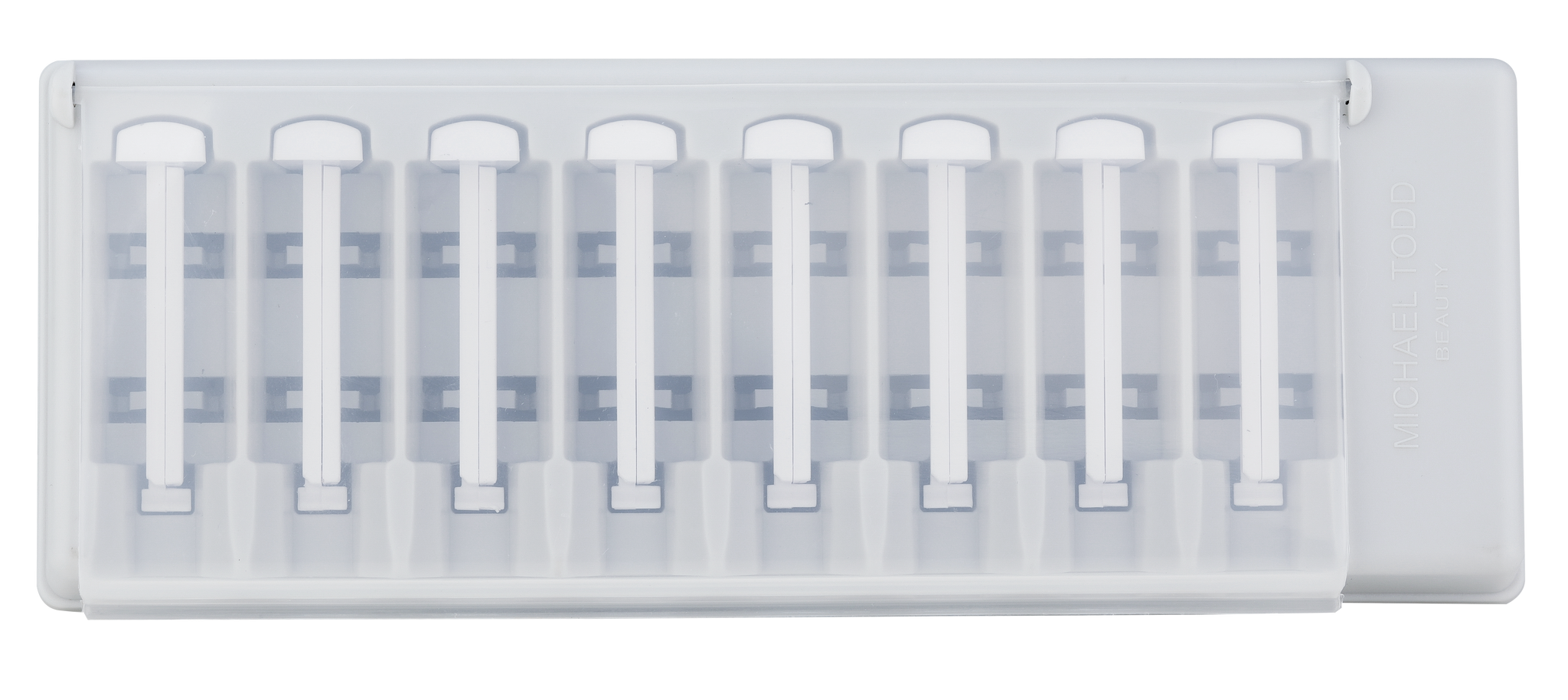 A white plastic holder containing eight individually slotted Sonicsmooth Refill Tips from Michael Todd Beauty for the Sonicsmooth tool.