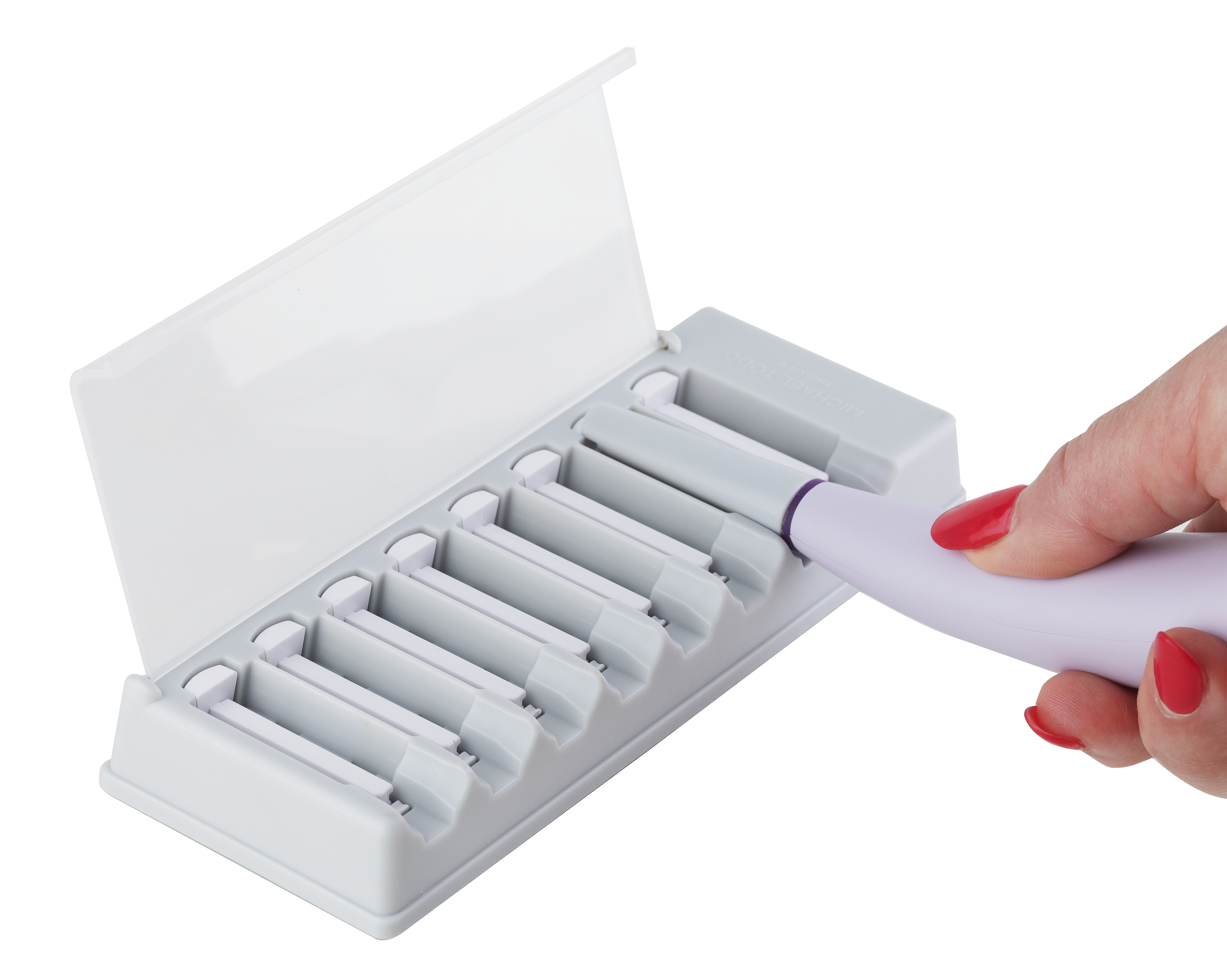 A hand is holding a nail filer in a white case, with Sonicsmooth Replacement Tips by Michael Todd Beauty in mind.