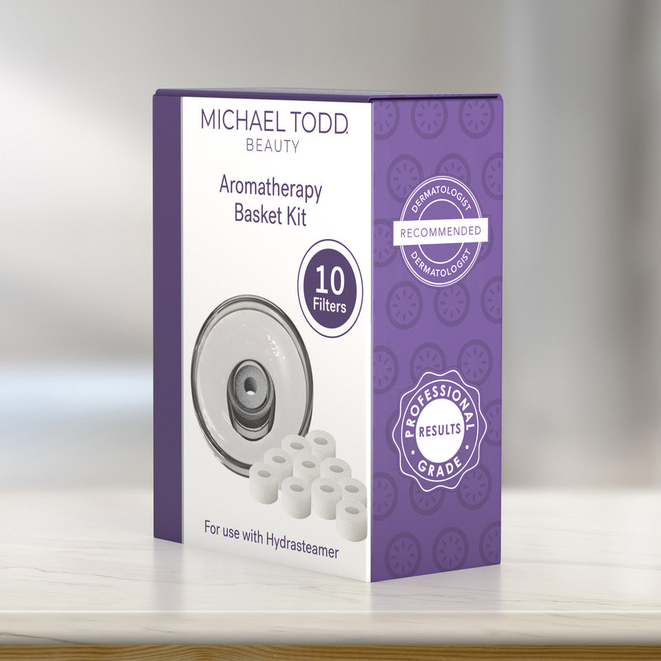 A box labeled "Michael Todd Beauty Hydrasteamer Aromatherapy Basket & Filters Kit" with 10 filters. The box features a purple and white design, along with badges that read "Dermatologist Recommended" and "Professional Grade. visible_badge