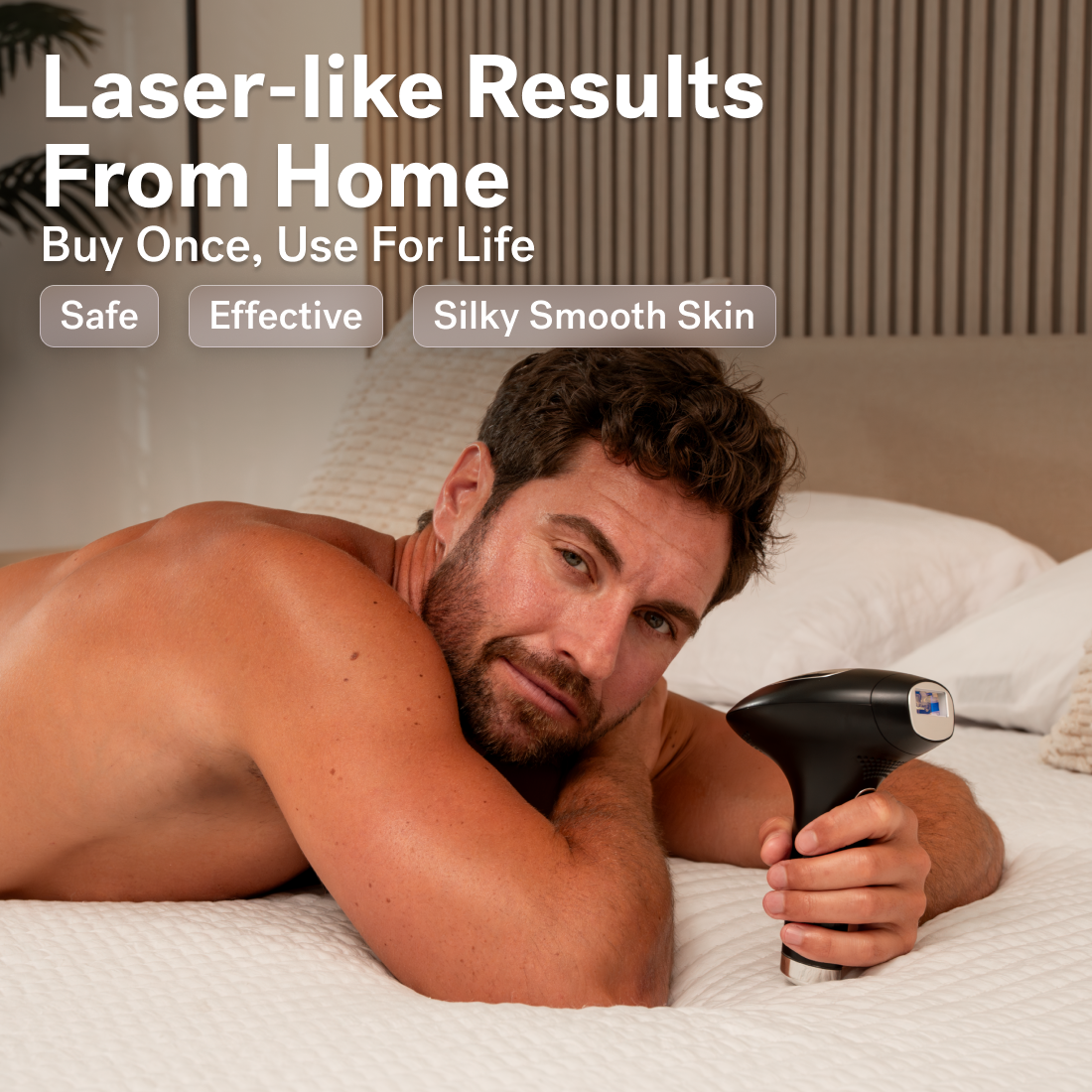 Black - A man lies on a bed holding a handheld device. The text reads, "Laser-like Results From Home with Lumos IPL and COOLMAX cooling technology by Michael Todd Beauty. Buy Once, Use For Life. Safe, Effective Hair Removal for Silky Smooth Skin.