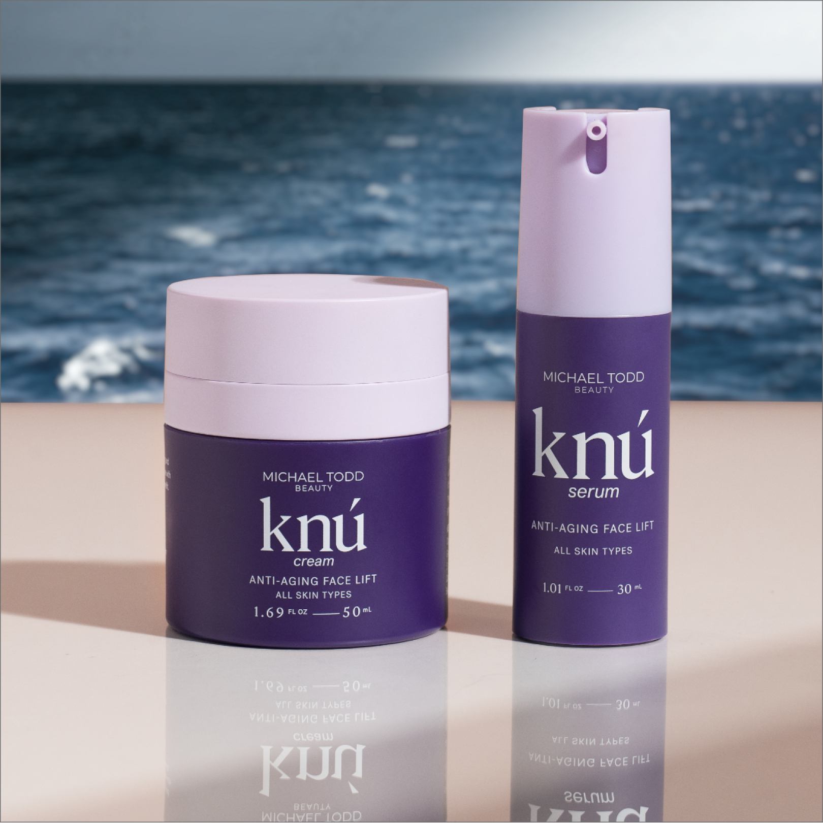 Rejuvenated Knú Ageless Duo face and eye cream on a table by the ocean.