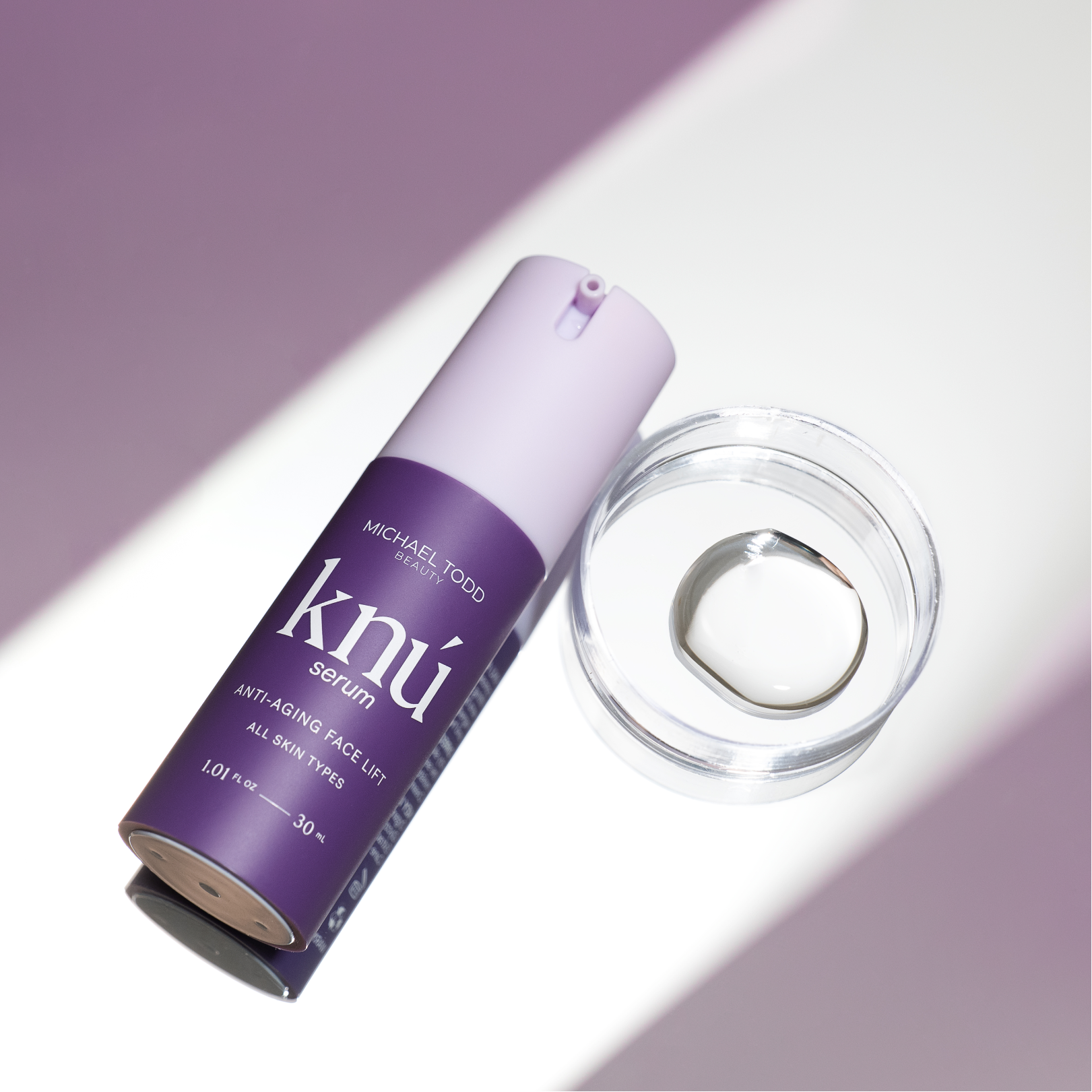 A bottle of Knú Ageless Duo serum with a Michael Todd Beauty ring next to it.