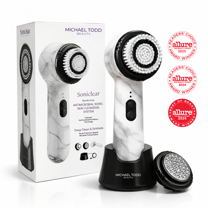 White Marble The Michael Todd Beauty Soniclear facial brush includes a stand, extra antimicrobial brush head, and packaging. Dermatologist recommended and winner of the 2024 & 2025 Allure Readers' Choice awards.