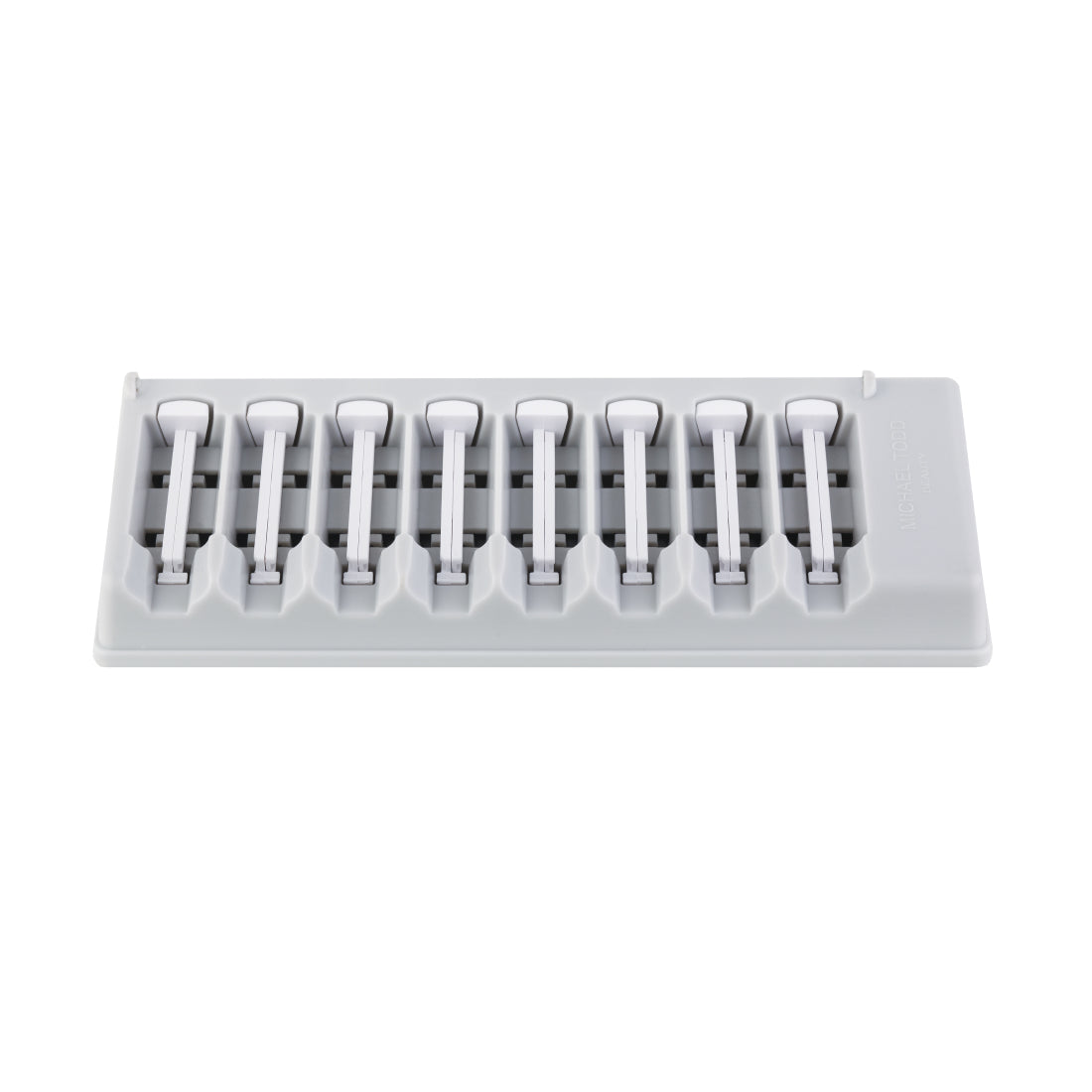 A gray ice cube tray with a white lid, featuring 8 compartments for making ice cubes, similar in precision to Michael Todd Beauty’s Sonicsmooth Refill Tips. 2 Month Supply