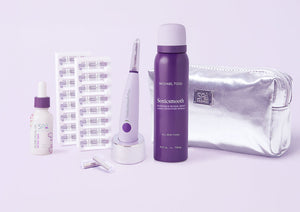 The Sonicsmooth Pro+ Complete Glow by Michael Todd Beauty includes a dropper bottle, capsule strips, electric device with stand, spray bottle, replacement heads, and a silver cosmetic bag, all displayed on a light background.