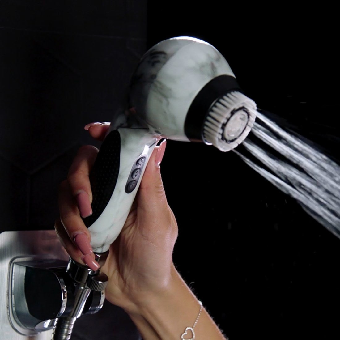 A hand holding a Stay Balanced skincare delivery system from Michael Todd Beauty.