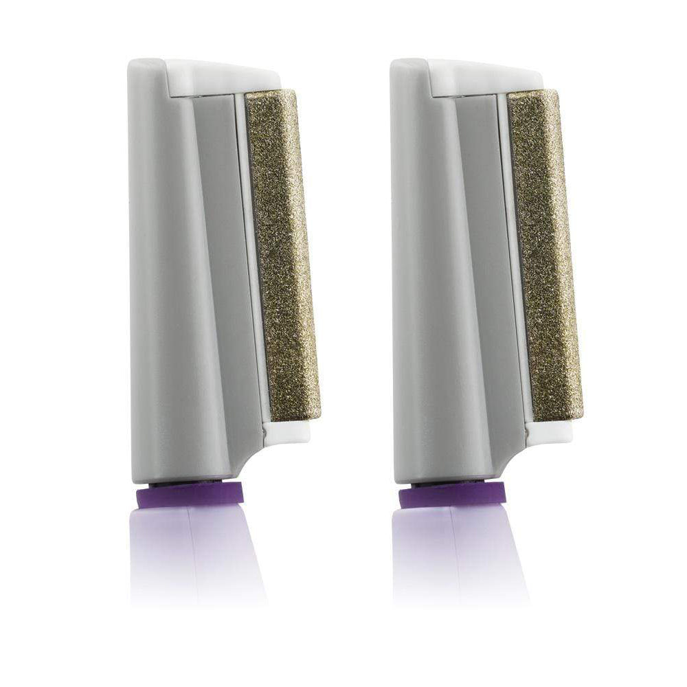 A pair of white and purple Michael Todd Beauty Microsmooth toothbrushes on a surface. visible_badge